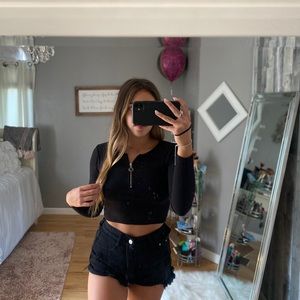 black long sleeve crop top with circle zipper